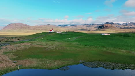 A-Panoramic-Vista-of-Church-in-Hellissandur,-West-Iceland---Drone-Orbit
