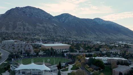 Brigham-Young-University-campus-in-Provo,-Utah-at-dawn---pullback-aerial-reveal