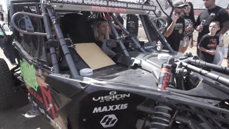 Two-nautgty-girls-taking-selfie-inside-buggy-rally-car-in-Baja-500-race,-Mexico