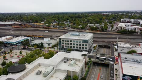Aerial-view-over-the-cityscape,-toward-the-train-yard-of-Roseville,-CA,-USA