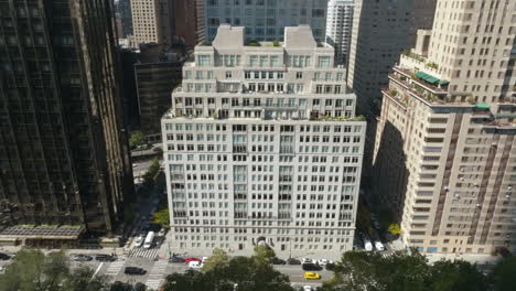 Dolly-zoom-drone-shot-in-front-of-the-15-Central-park-west-in-sunny-New-York