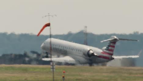 Telephoto-Pan-of-Plane-Taking-Off-from-Airport-in-Washington-DC