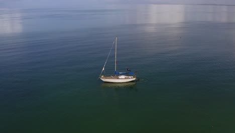Aerial-Views-of-boat-on-water-in-Coche-Island-in-Venezuela-4K-by-drone
