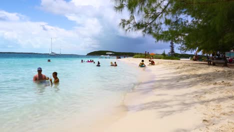 This-is-a-static-shot-of-people-relaxing-on-the-famous-Chat-'N'-Chill-beach-on-Exuma-in-the-Bahamas