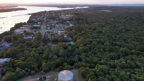 Aerial-Above-Town-Of-Iluka-At-Sunset