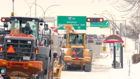 Snow-Blowing-Tractors-And-Truck-Clearing-Snow-On-The-Street-In-Montreal-After-Snowstorm