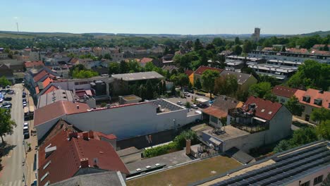 Flying-Over-Mistelbach-Town-In-Austria-During-Summer---drone-shot