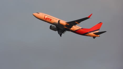 Lynx-Air-Boeing-737-Flying-and-Gaining-Height-in-Sunset-Light