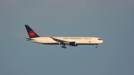 Sideways-portrait-of-cargo-plane-approaching-runway-for-landing