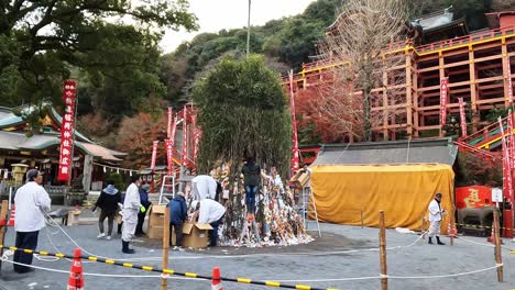 Monks-preparing-the-bonfire-and-offerings-at-Famous-fire-festival-at-Yutoku-Inari-Shrine-in-Kyushu,-Japan