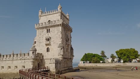 Belem-Tower-and-a-wooden-pier,-a-beautiful-view-during-the-day-in-Lisbon,-Portugal