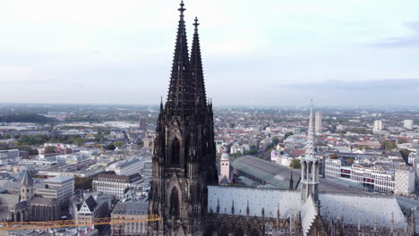 Aerial-Orbit-Around-Cologne-Cathedral-Revealing-City-and-Rhine-River