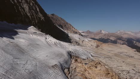 Glacier-in-mountains-descending-aerial