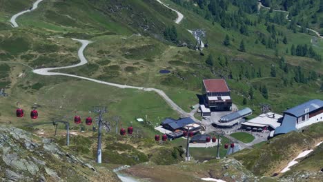 Occupants-travelling-in-cable-cars-at-the-kitzsteinhorn-resort,-aerial