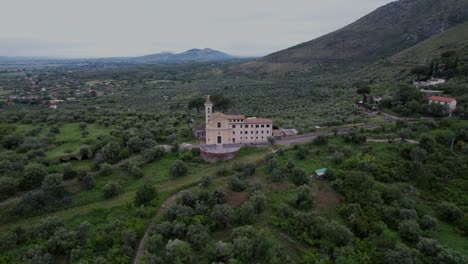 Shrine-of-our-Lady-of-Quintiliolo-church-aerial-orbit-Tivilo,-Italy