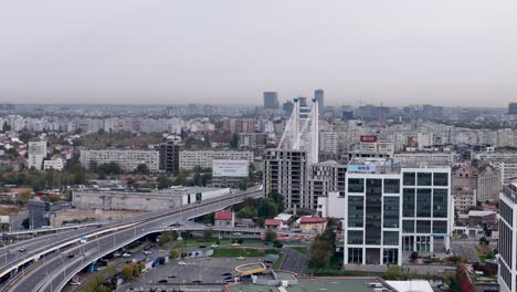 Rotating-Aerial-View-Grozavesti-District-With-The-Basarab-Bridge-In-The-Background,-Romania,-Bucharest