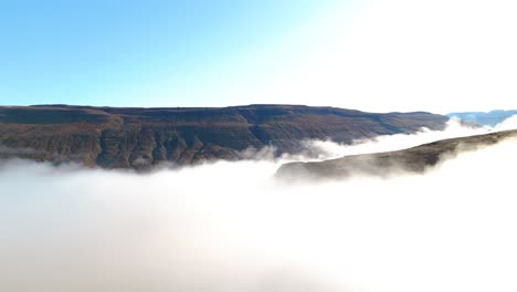 Aerial-view-of-dense-fog-on-mountain-landscape-of-Iceland
