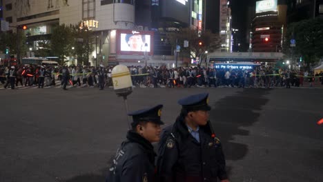Shibuya-Crossing-on-Halloween-guarded-by-police,-Tokyo-Japan