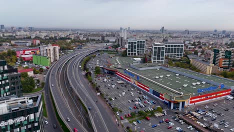 Rotating-Aerial-View-Grozavesti-District-With-The-Basarab-Bridge-In-The-Background,-Romania,-Bucharest