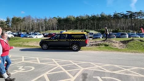 Welsh-coast-guard-vehicle-routine-inspection-departing-Newborough-forest-car-park-heading-towards-beach
