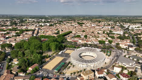 Aerial-view-of-Lunel-in-the-daytime,-with-its-arenas-as-a-prominent-feature.