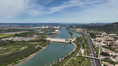 Aerial-vista:-Donzère-Mondragon-Dam,-a-historic-powerhouse-of-hydro,-wind,