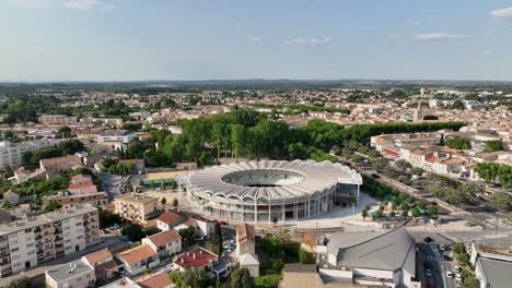 In-the-daylight,-Lunel-offers-a-bird's-eye-view-of-its-arenas,-a-city-landmark.