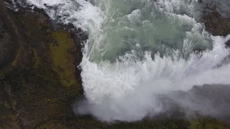 Aerial-drone-shot-flying-over-Gulfoss-waterfall-in-Iceland.-Cloudy-day
