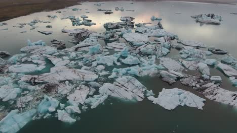 Aerial-drone-shot-over-Jokulsarlon-(Iceland's-most-famous-glacier-lagoon)