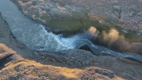 Aerial-drone-shot-vertical-top-view-of-Dettifoss-powerful-waterfall-in-Europe
