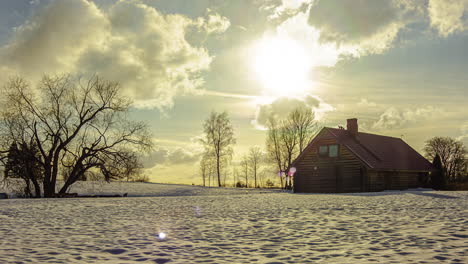 Picturesque-Sunset-Over-Isolated-Lodge-in-Winter-Snow-Timelapse