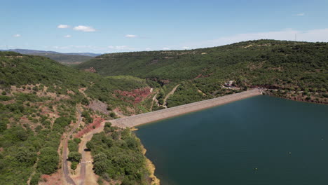 Salagou-electric-dam-aerial-back-traveling-sunny-day-France