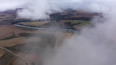 Amazing-aerial-shot-over-clouds-South-African-river-countryside