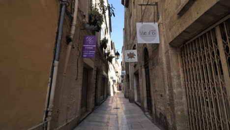 narrow-street-with-closed-shops-in-the-town-of-Montpellier-during-lockdown