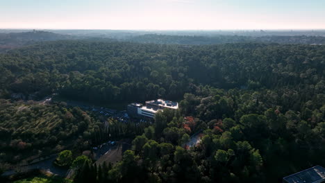 Scientific-buildings-blend-into-lush-greenery-in-Montpellier-aerial-sunny-day