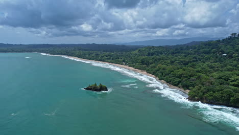 Beach,-palm-trees,-and-lush-tropical-jungle-in-Puerto-Viejo,-Costa-Rica.