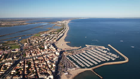Aerial-shot-of-Palavas-les-flots-marina,-beaches,-and-town-layout.