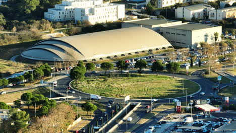 Roundabout-and-modern-building-aerial-Montpellier-sunny-day