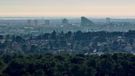 Elevated-shot-of-Montpellier's-urban-sprawl-and-forests.