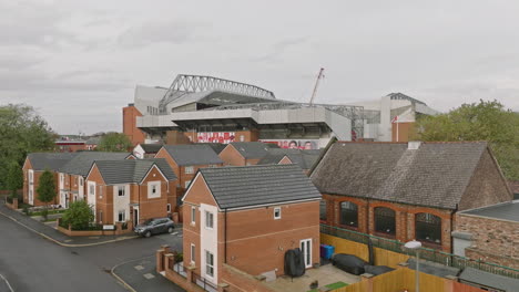 aerial-shot-encapsulating-the-stadium-and-its-immediate-environs,-as-clouds-dri