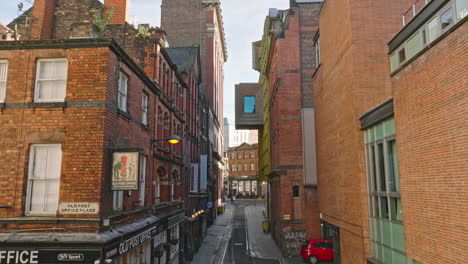 Soar-above-city-center-alleys,-capturing-Liverpool's-historic-essence.