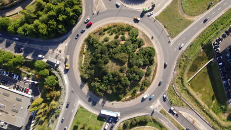 Aerial-view-of-a-bustling-roundabout-in-Montpellier,-capturing-the-dynamic-flow
