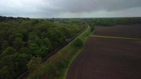 Aerial-Drone-4K-footage-of-the-Poppy-Railaway-line-between-Holt-and-Cromer,-North-Norfolk