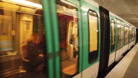 Two-Metro-Trains-with-People-Arrive-to-Underground-Station-Blanche,-Paris-France