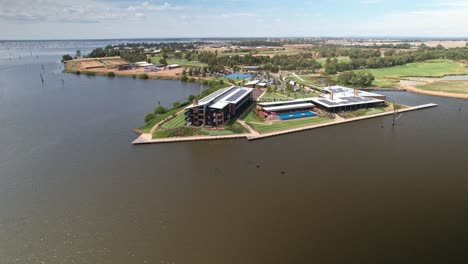 Yarrawonga,-Victoria-Australia---February-10-2022:-Aerial-view-over-Lake-Mulwala-to-the-Sebel-Hotel-and-new-housing-beyond