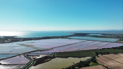 Aigues-Mortes-from-the-skies:-a-dance-of-rosy-salines-and-azure-waters.