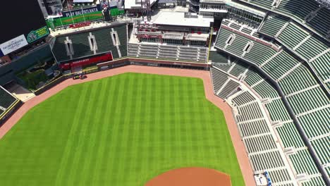 Aerial-birds-eye-shot-of-empty-Truist-Park-Baseball-Stadium-and-Omni-Hotel-in-Atlanta-City,-Georgia