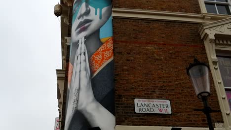 Graffiti-on-top-of-a-building-on-the-corner-of-Lancaster-and-Portobello-Roads