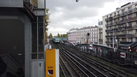 Two-Trains-Depart-and-Arrive-to-Outdoors-City-Metro-Stalingard-Paris-Station