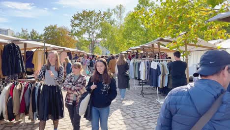 People-Buying-Used-Clothes-on-Vintage-Flea-Market-in-Berlin,-Germany